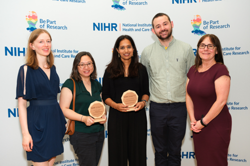 An image of our research team getting an award